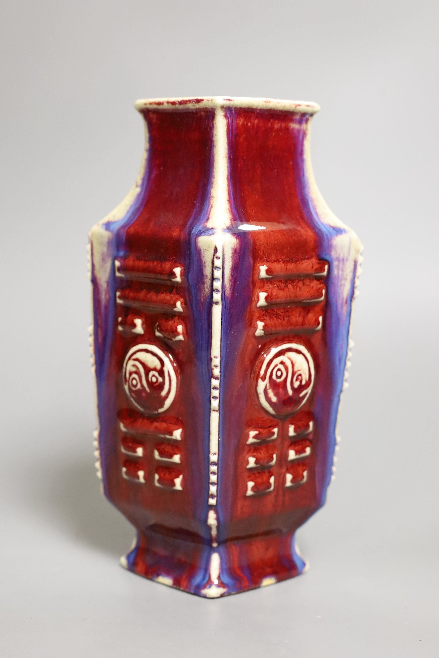 A Chinese flambe ‘eight trigrams’ lozenge section vase, late 19th / early 20th century, 22cm tall